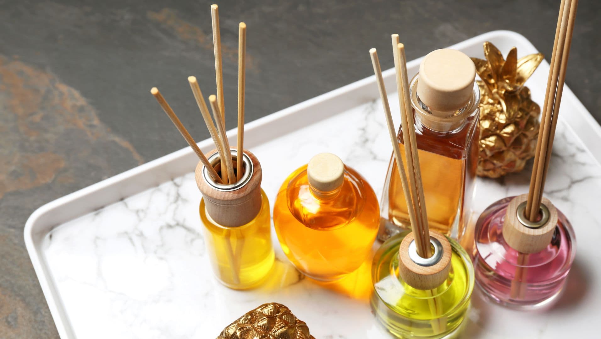 Close-up of assorted diffuser reeds on a wooden surface