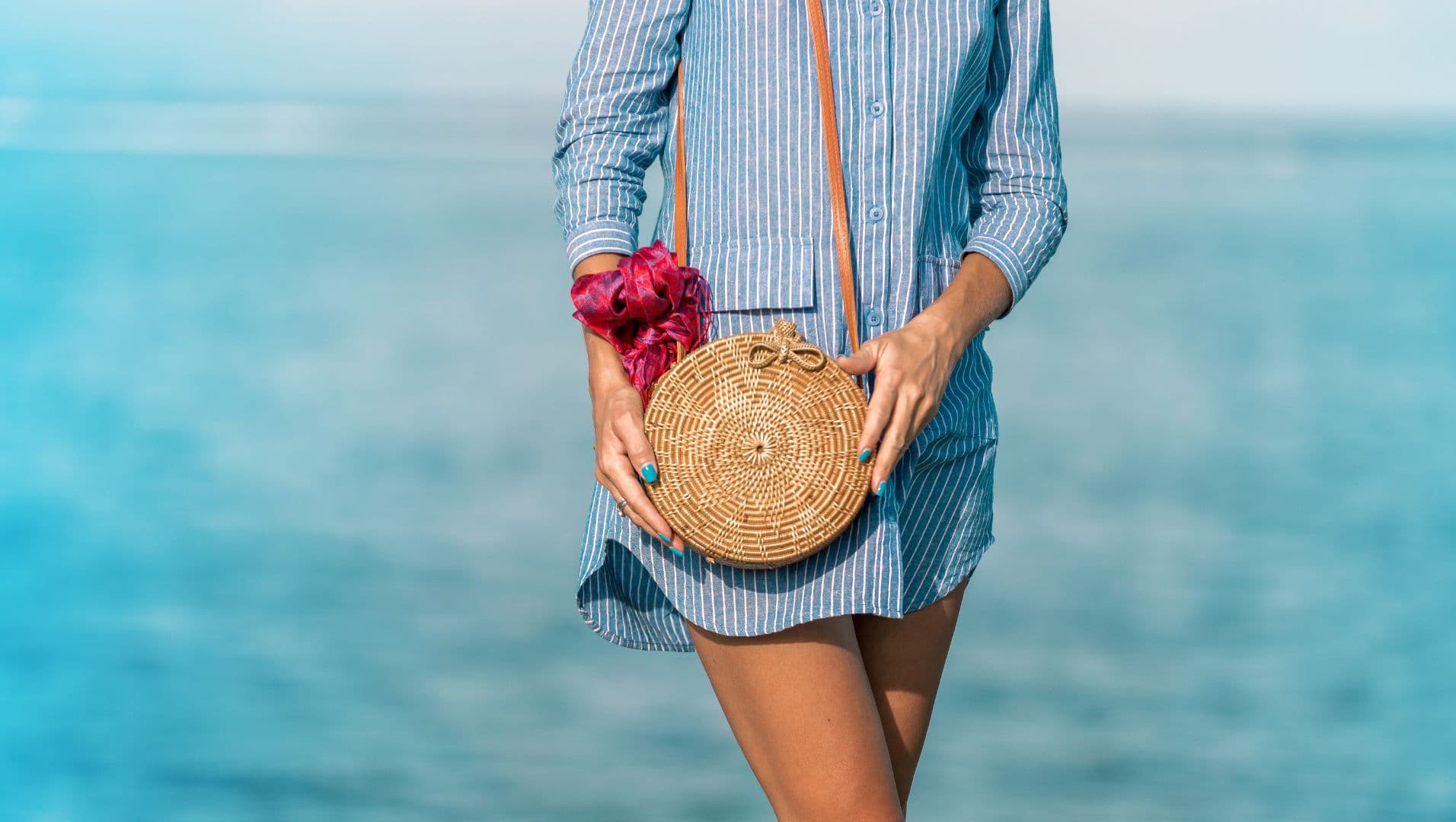 A lady carrying a personalized rattan bag